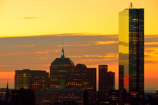 Dramatic sunrise over Boston Downtown as seen from Cambridge