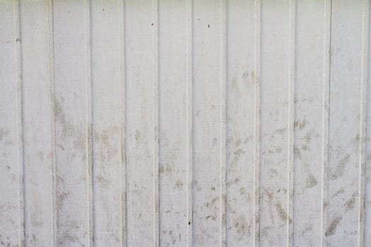 A striped wooden painted backgroudn with some dirt and scuffs on it.