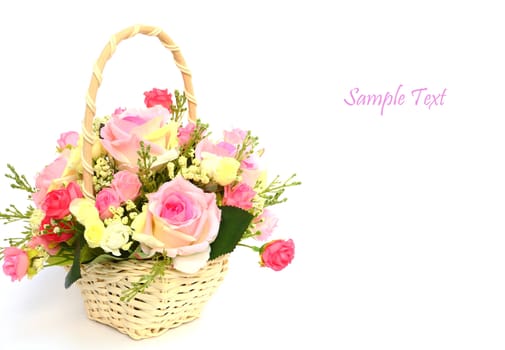 Bouquet of roses in white basket with space for text