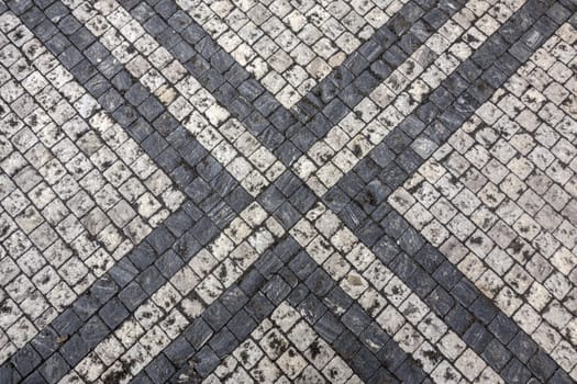 Texture of black and white stone structure road in Prague 