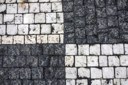 Texture of black andwhite stone structure road in Prague 