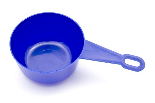 Blue measuring spoon closeup on white background
