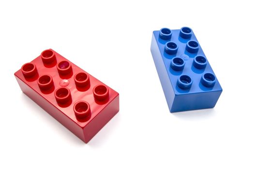 Colorful building blocks closeup on white background 