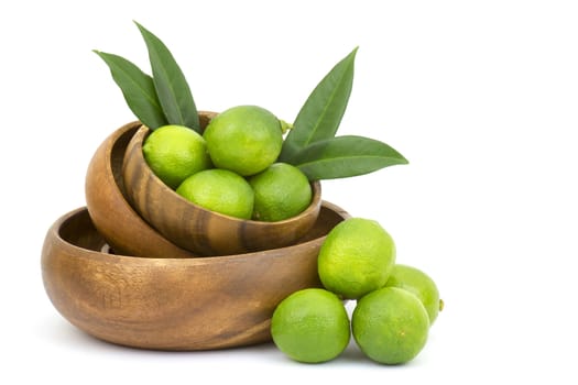 Wooden bowl filled with limes