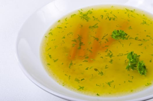 a fresh summery broth with leek onion, and carrot