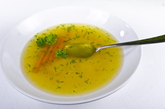 a fresh summery broth with leek onion, and carrot