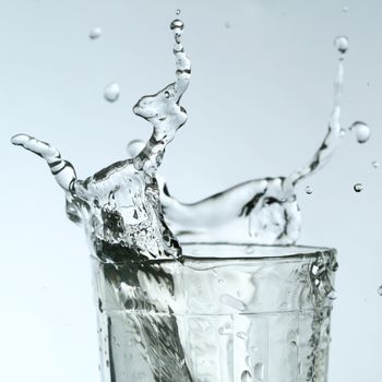 super splash in glass on white background