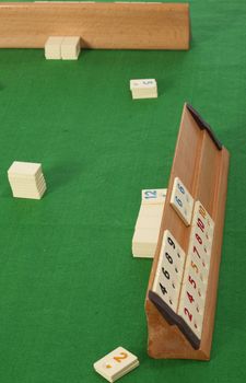 empty  rummy table over green background