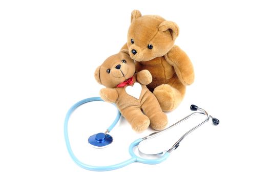 Two teddy bears and a stethoscope