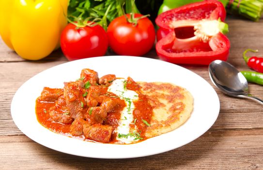 Hungarian goulash with potato pancakes