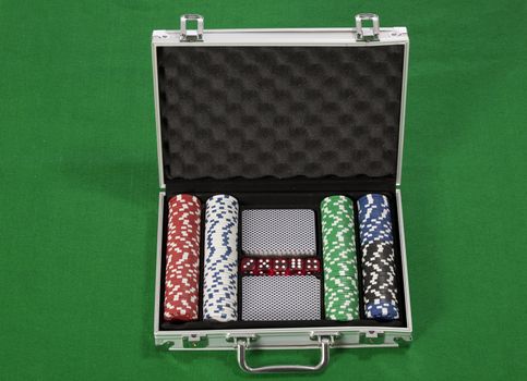 A photo of poker chips and cards in a briefcase