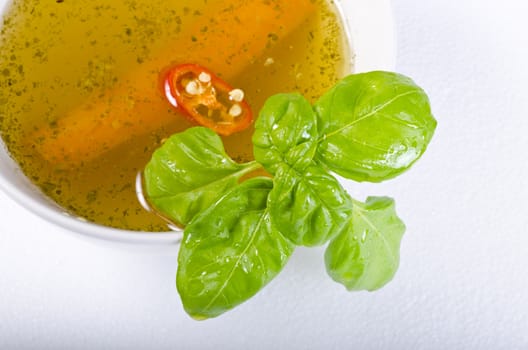 a fresh summery broth with leek onion, and carrot