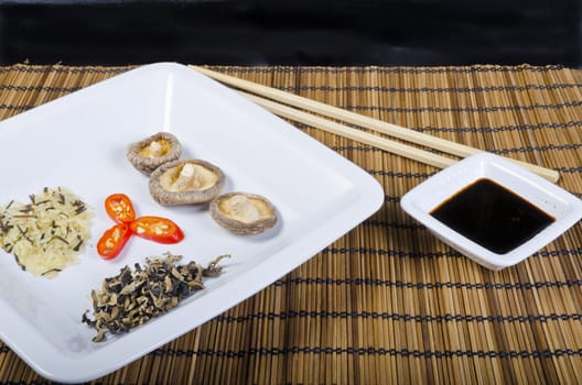 Rice and mushroom and Shiitake has young zwibel on plate with Mu Err