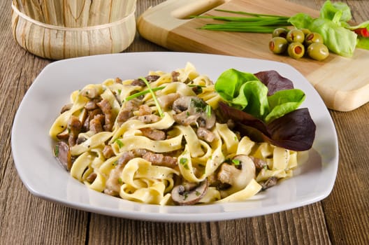 Tagliatelle with tail steak stripe and champignons