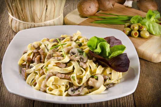 Tagliatelle with tail steak stripe and champignons