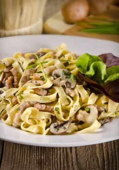 Tagliatelle with tail steak stripe and champignons