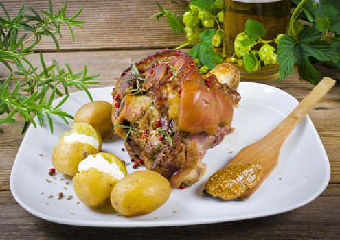 Roasted pork knuckle. Ham and bacon are popular foods in the west, and their consumption has increased with industrialisation.