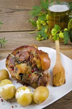 Roasted pork knuckle. Ham and bacon are popular foods in the west, and their consumption has increased with industrialisation.