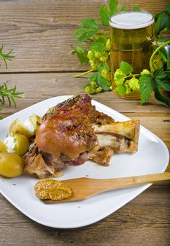 Roasted pork knuckle. Ham and bacon are popular foods in the west, and their consumption has increased with industrialisation.