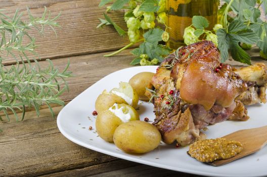 Roasted pork knuckle. Ham and bacon are popular foods in the west, and their consumption has increased with industrialisation.