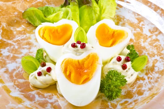 Boiled eggs are eggs (typically chickens' eggs) cooked by immersion in boiling water with their shells unbroken.