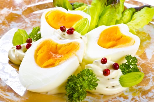 Boiled eggs are eggs (typically chickens' eggs) cooked by immersion in boiling water with their shells unbroken.