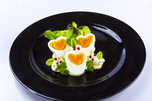 Boiled eggs are eggs (typically chickens' eggs) cooked by immersion in boiling water with their shells unbroken.