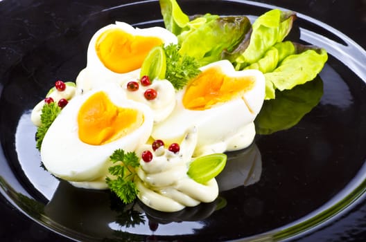 Boiled eggs are eggs (typically chickens' eggs) cooked by immersion in boiling water with their shells unbroken.