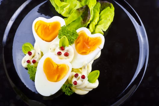 Boiled eggs are eggs (typically chickens' eggs) cooked by immersion in boiling water with their shells unbroken.