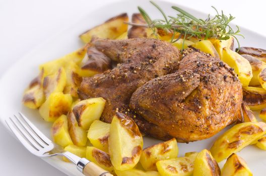 chickens roast with baking potatoes