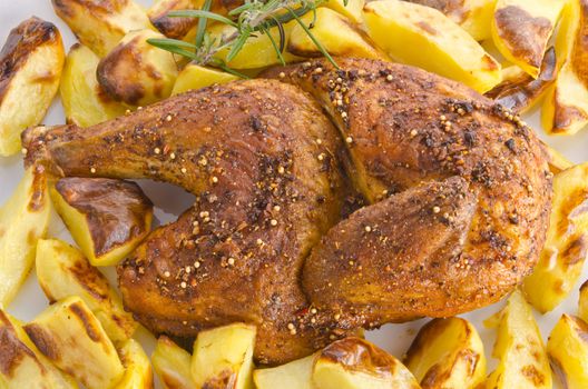 chickens roast with baking potatoes