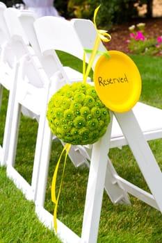 Flowers are placed together to create these unique green floral balls for wedding decor.