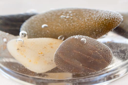 Bubbles have formed on these rocks that sit underwater in centerpieces at a wedding.