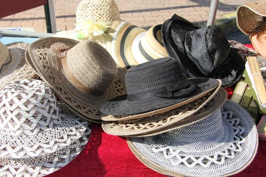 traditional straw hats at a market in the Provence