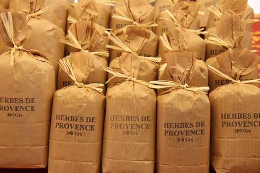 Herbs and spices in paper bags at a Provencal market in France