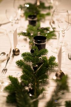 Festive XMas Table - Beautiful white, green and silver place setting for Christmas in emotional light
