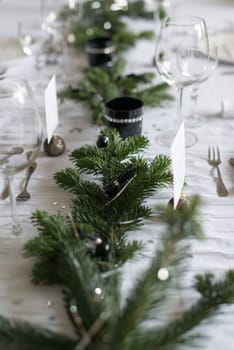 Festive XMas Table - Beautiful white, green and silver place setting for Christmas in bright daylight
