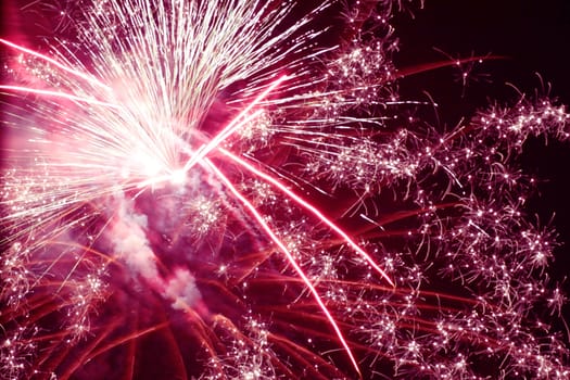 holiday fireworks in night sky