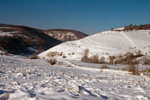 A lonely, snow-covered valley in winter