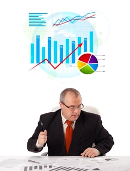 Businessman sitting at desk with statistics, isolated on white