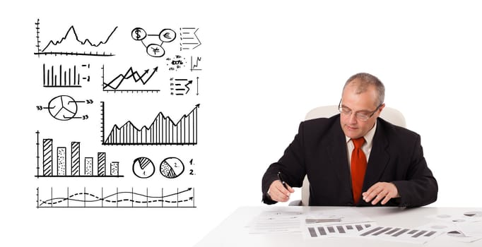 businessman sitting at desk with statistics and graphs, isolated on white