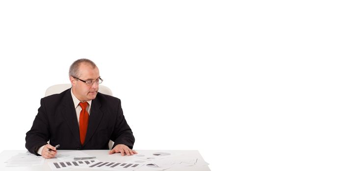 businessman sitting at desk with copy space, isolated on white