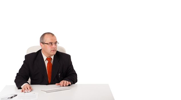 businessman sitting at desk and typing on keyboard with copy space, isolated on white