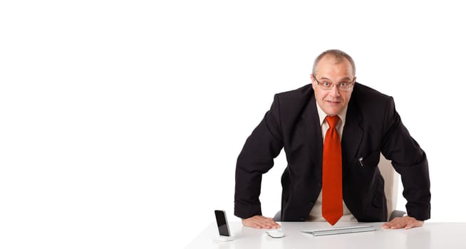 businessman sitting at desk with copy space, isolated on white