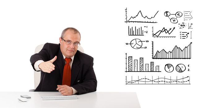 Businessman sitting at desk with diagrams and graphs, isolated on white