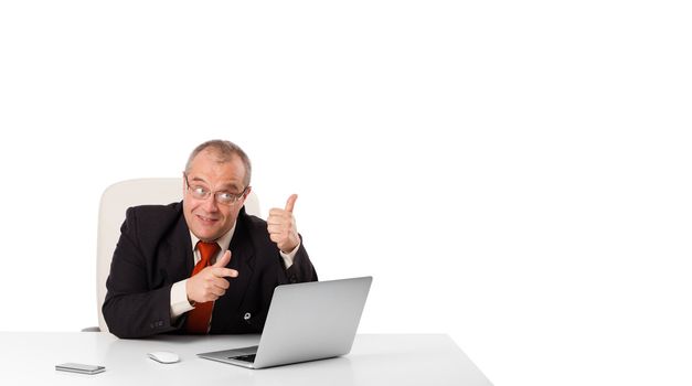 buisnessman sitting at desk and looking laptop with copy space, isolated on white