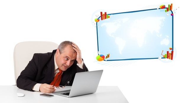 businessman sitting at desk and looking the laptop with copy space, isolated on white