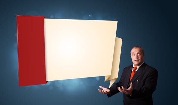 businessman in suit presenting modern origami copy space