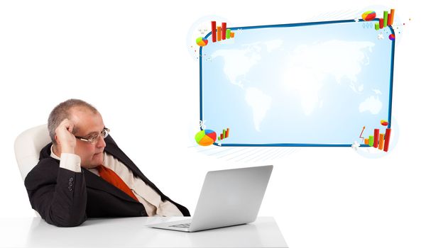 businessman sitting at desk and looking the laptop with copy space, isolated on white