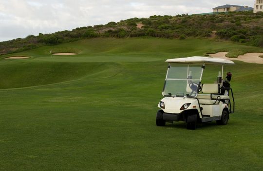 Golf cart at beach or seaside holiday resort course